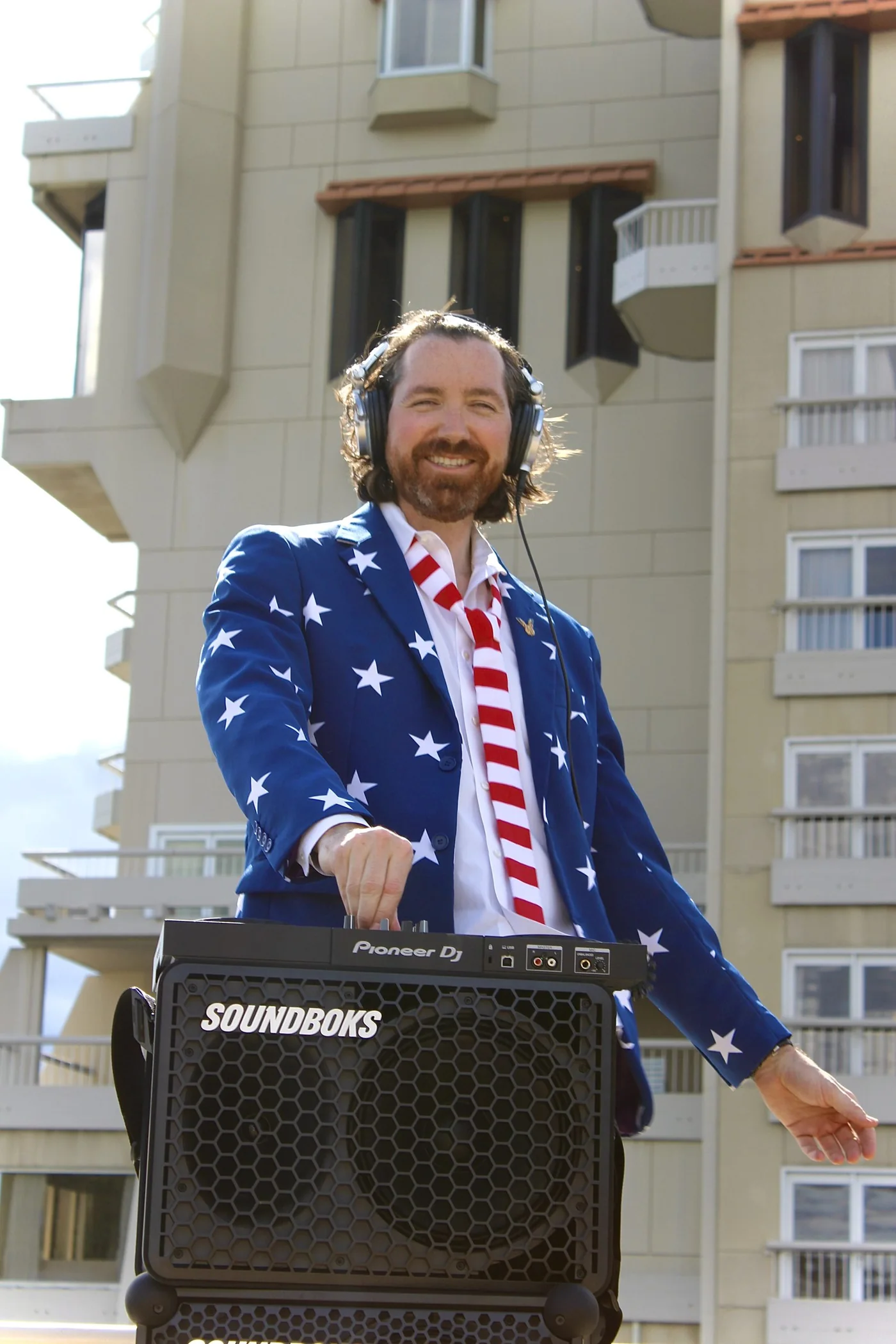 DJ Daymaker performing beneath star lights